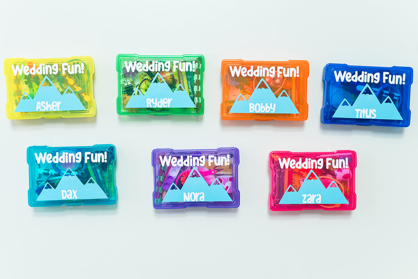 Set of colorful wedding-themed candy packages on a white background