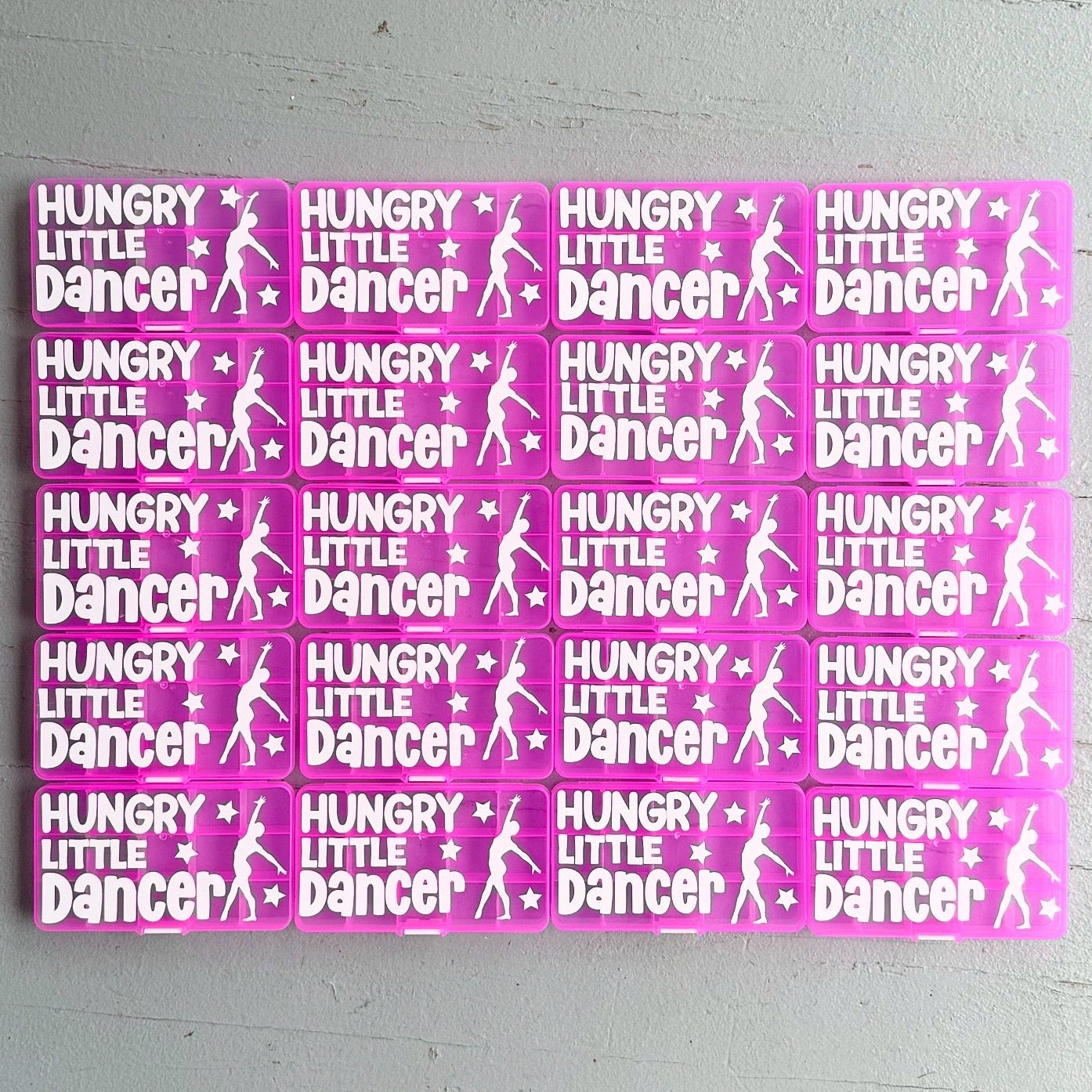 Multiple 'Hungry Little Dancer' stickers on a gray background