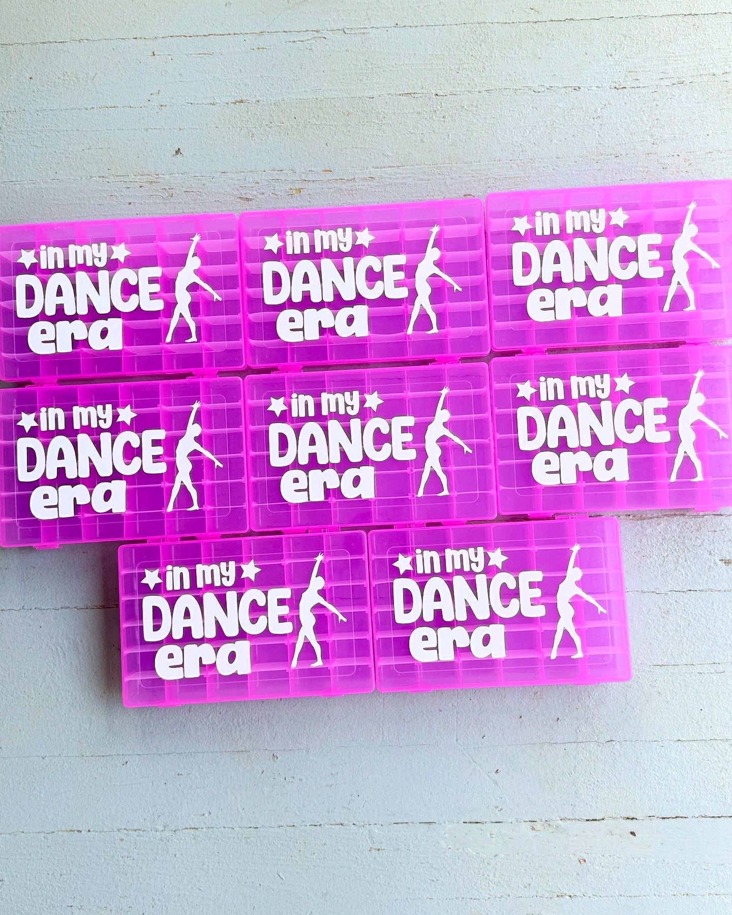 Pink rectangular stickers with 'In my Dance Era' text and dancer silhouette on a light blue background