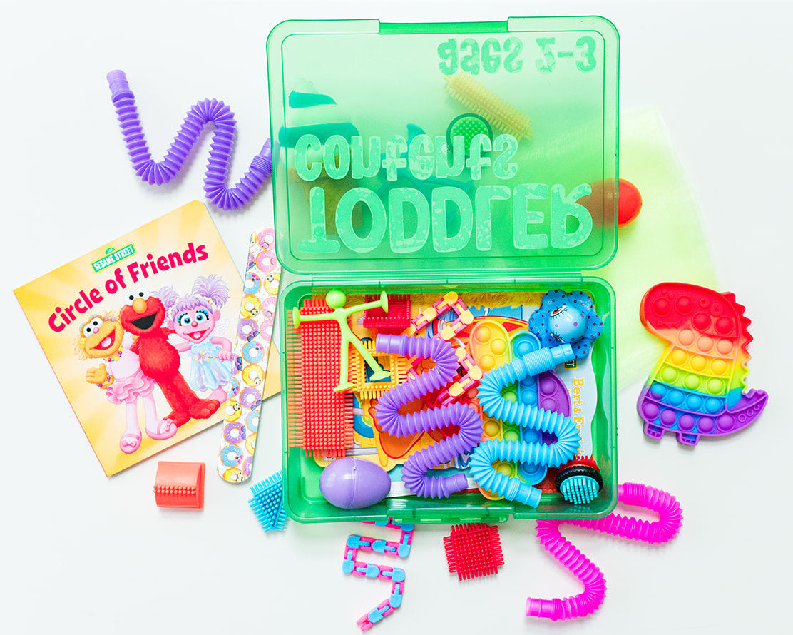 Colorful toy set with a book titled 'Circles of Friends' on a white background