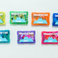 Set of colorful wedding-themed candy packages on a white background
