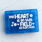 Blue rectangular object with text 'my HEART is on that FIELD kaijah's mom' on a light gray background