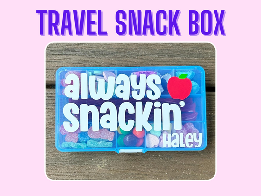 blue rectangle plastic snack box filled with candy and treats. Always snackin wording with the name Haley personalization plus a red apple on top of the snack box.