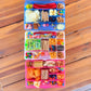 Colorful compartments filled with snacks on a wooden surface