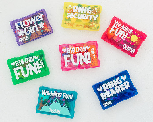 Colorful wedding-themed pins on a white background