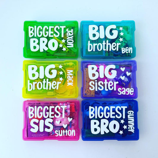 6 bright colored busy boxes with variations big brother big sister wording. All personalized with child's names. Green, aqua, yellow, purple, blue, pink boxes.